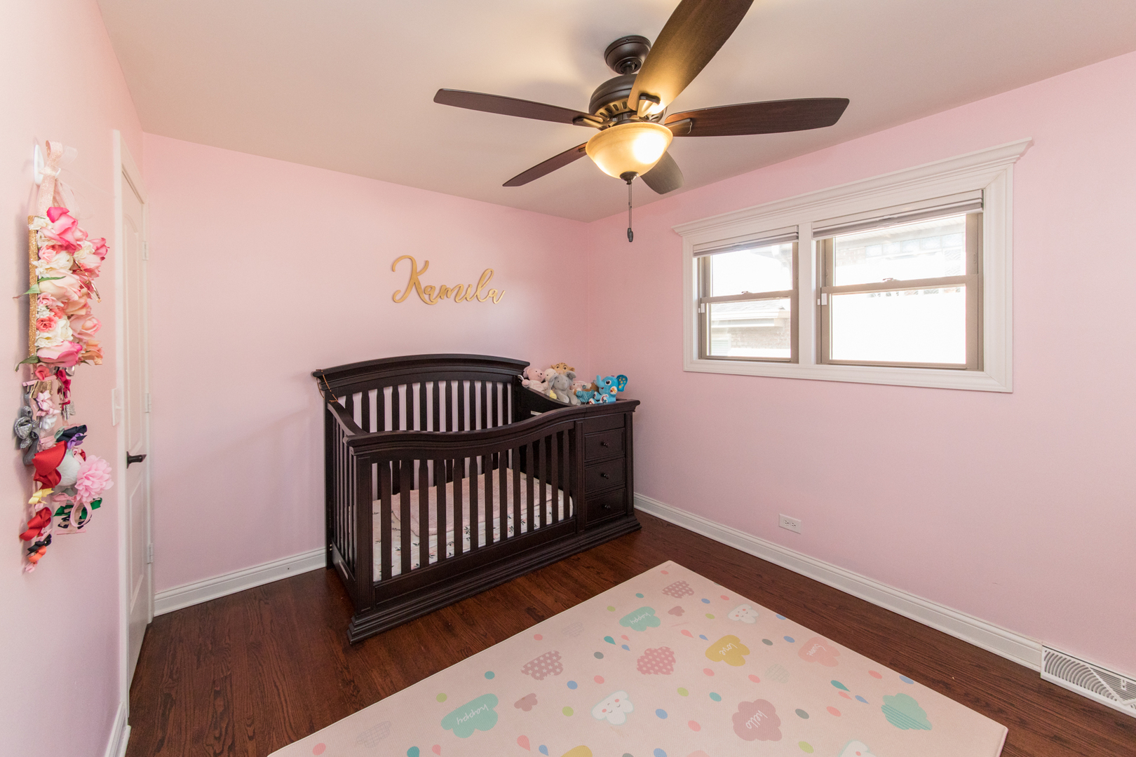8653 North Merrill Street Niles, IL 60714 - Photo 13 of 19 a view of an empty room with a window and wooden floor