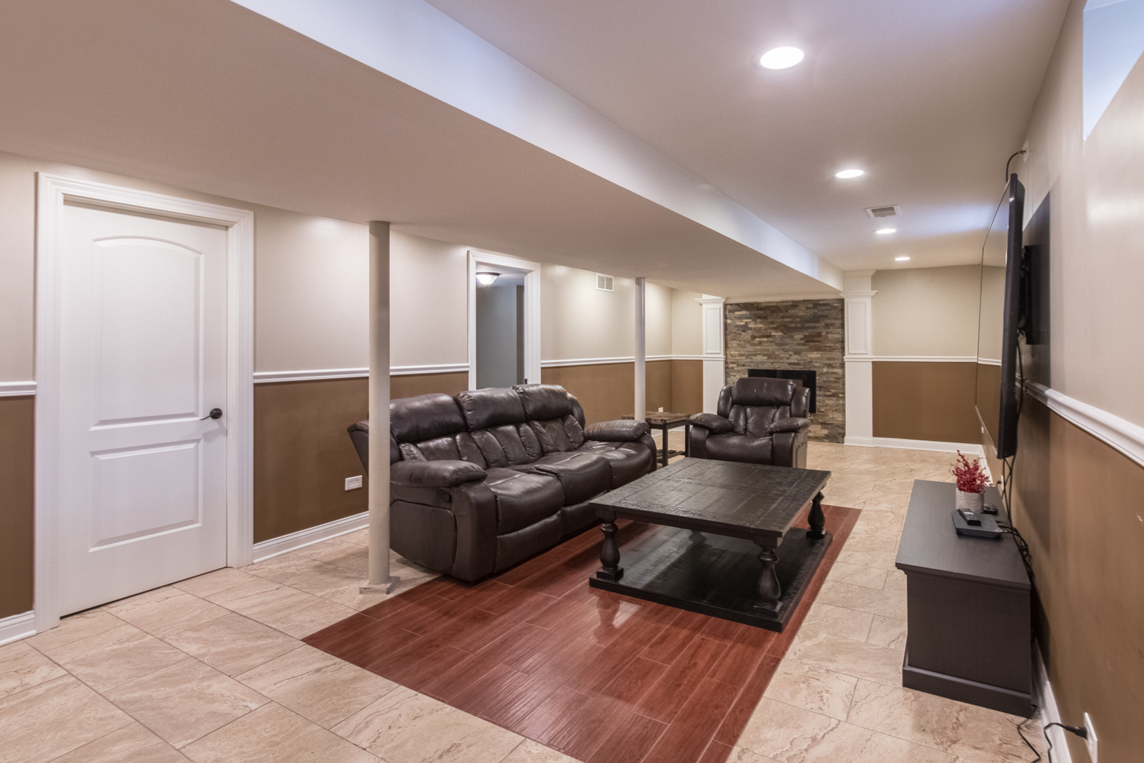 8653 North Merrill Street Niles, IL 60714 - Photo 15 of 19 a living room with furniture and a flat screen tv