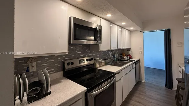 a kitchen with a stove and a microwave