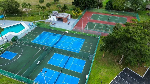 a view of a yard with furniture and a garden