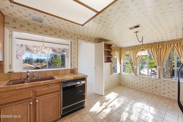 a kitchen with a stove and a sink