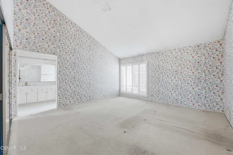 a view of an empty room and window