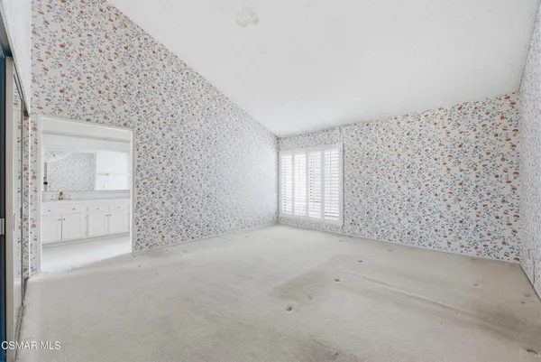 a view of an empty room and window