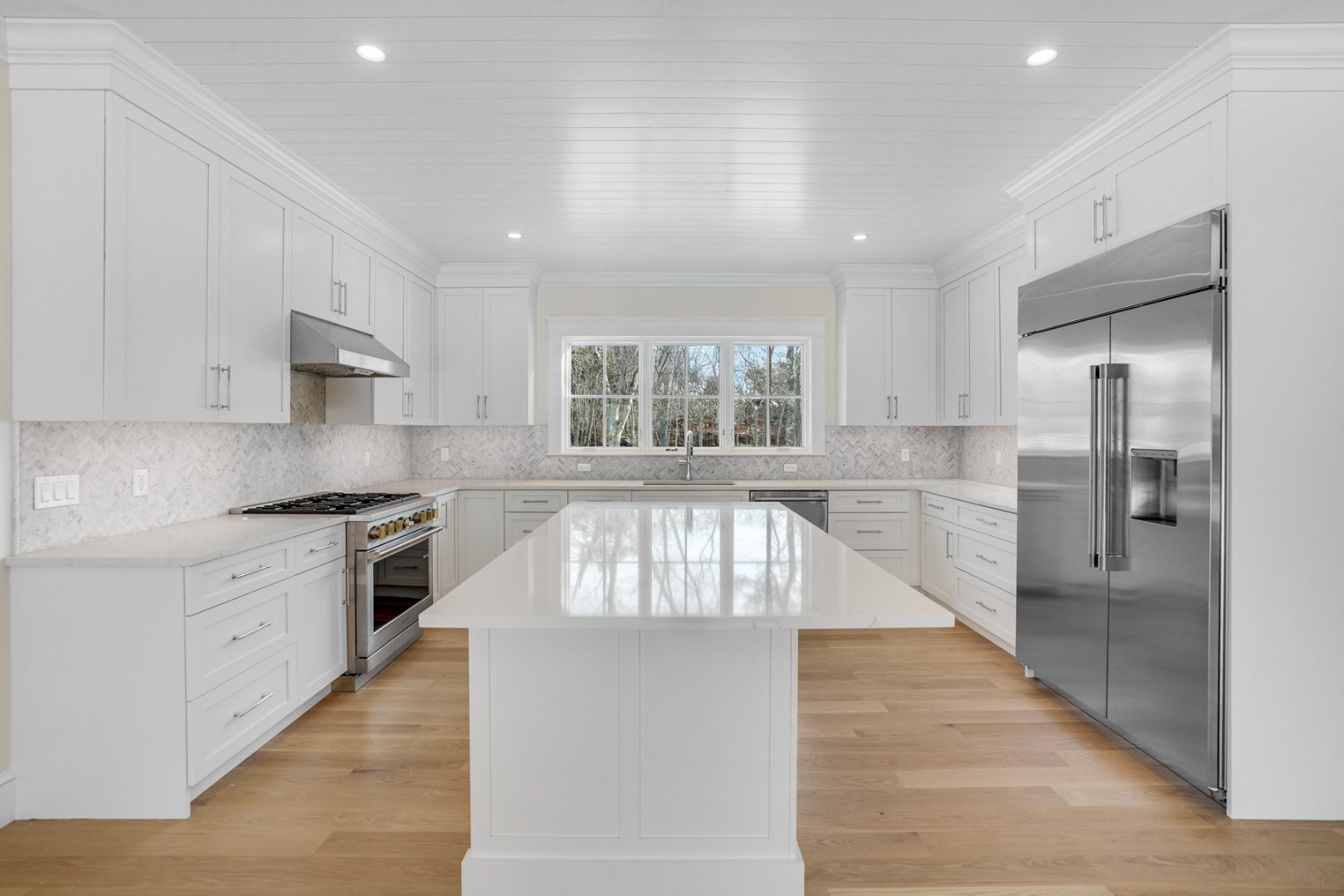 9 Martha's Way Edgartown, MA 02539 - Photo 12 of 41 a large kitchen with stainless steel appliances granite countertop a large counter top a sink a refrigerator and a stove