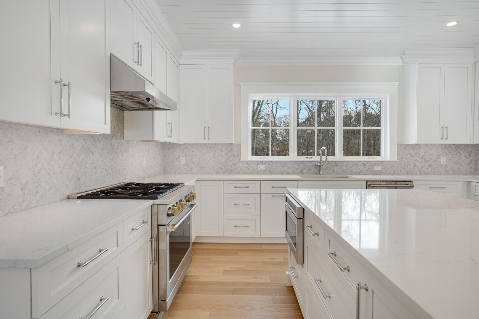 9 Martha's Way Edgartown, MA 02539 - Photo 14 of 41 a kitchen with granite countertop a sink stove and cabinets