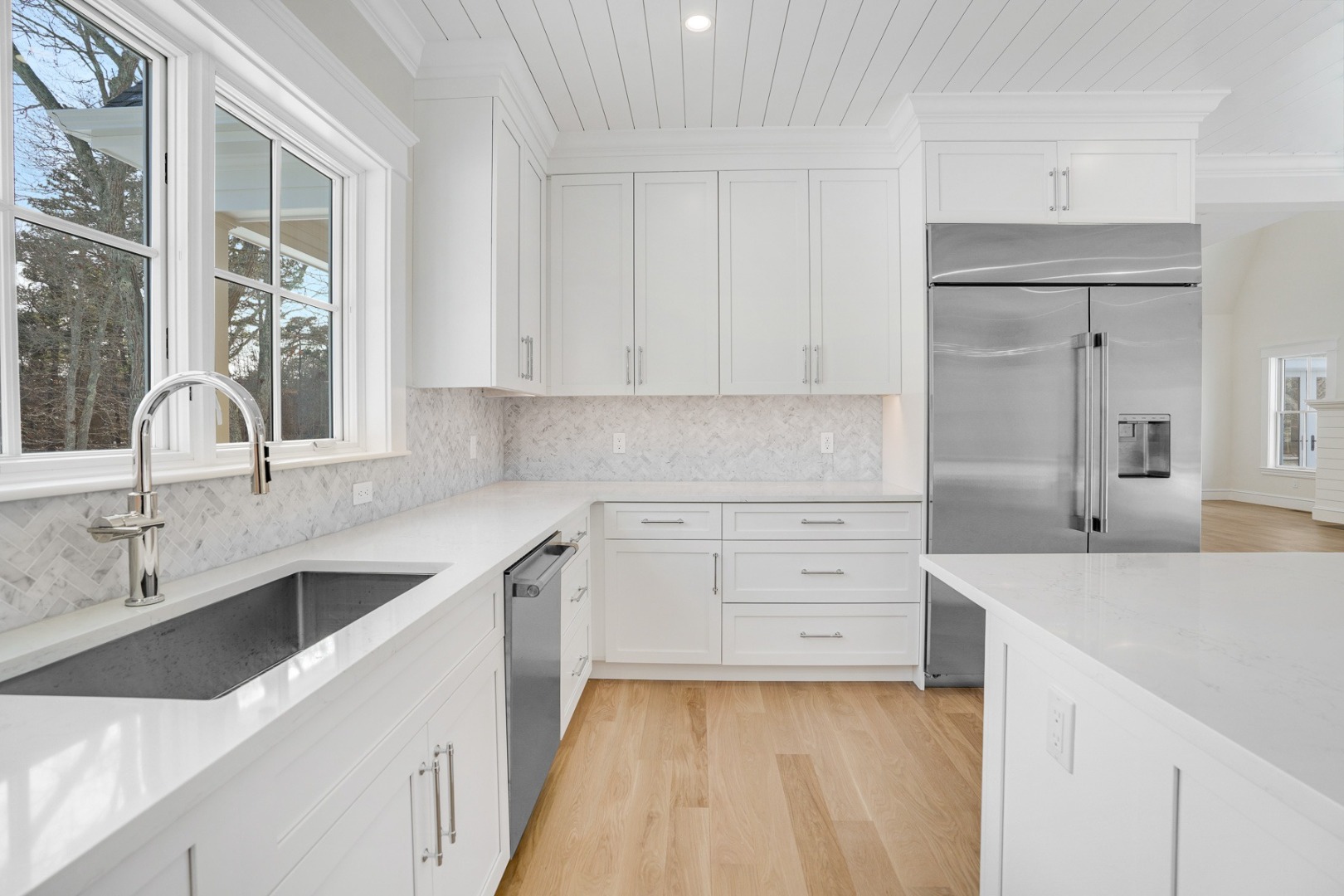 9 Martha's Way Edgartown, MA 02539 - Photo 15 of 41 a kitchen with a sink stove and cabinets