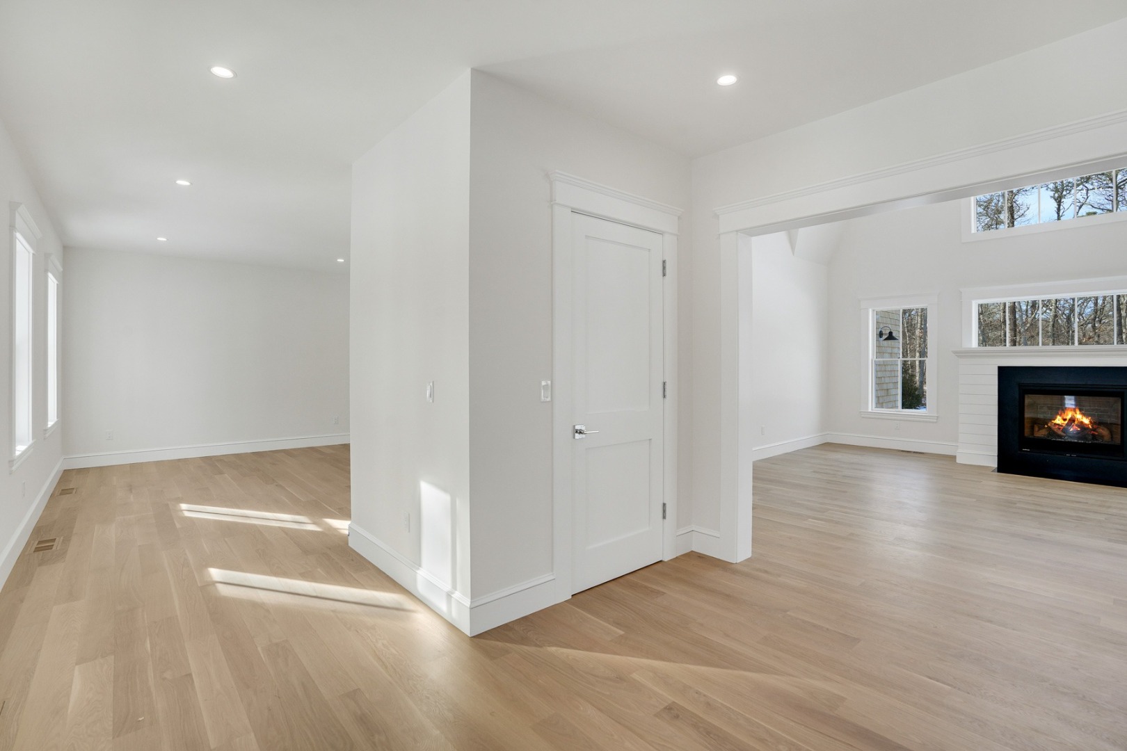 9 Martha's Way Edgartown, MA 02539 - Photo 17 of 41 a view of an empty room with a fireplace and a window
