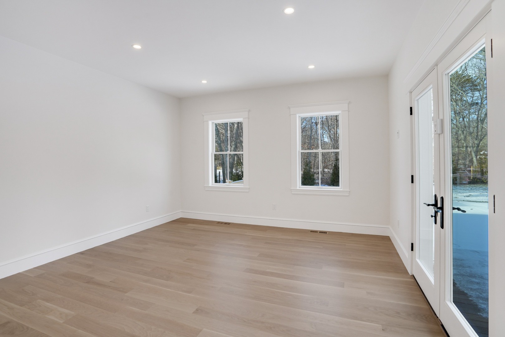 9 Martha's Way Edgartown, MA 02539 - Photo 20 of 41 wooden floor in an empty room with a window