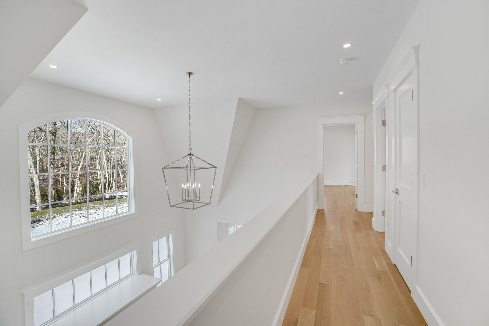 9 Martha's Way Edgartown, MA 02539 - Photo 26 of 41 a view of a hallway with windows and chandelier