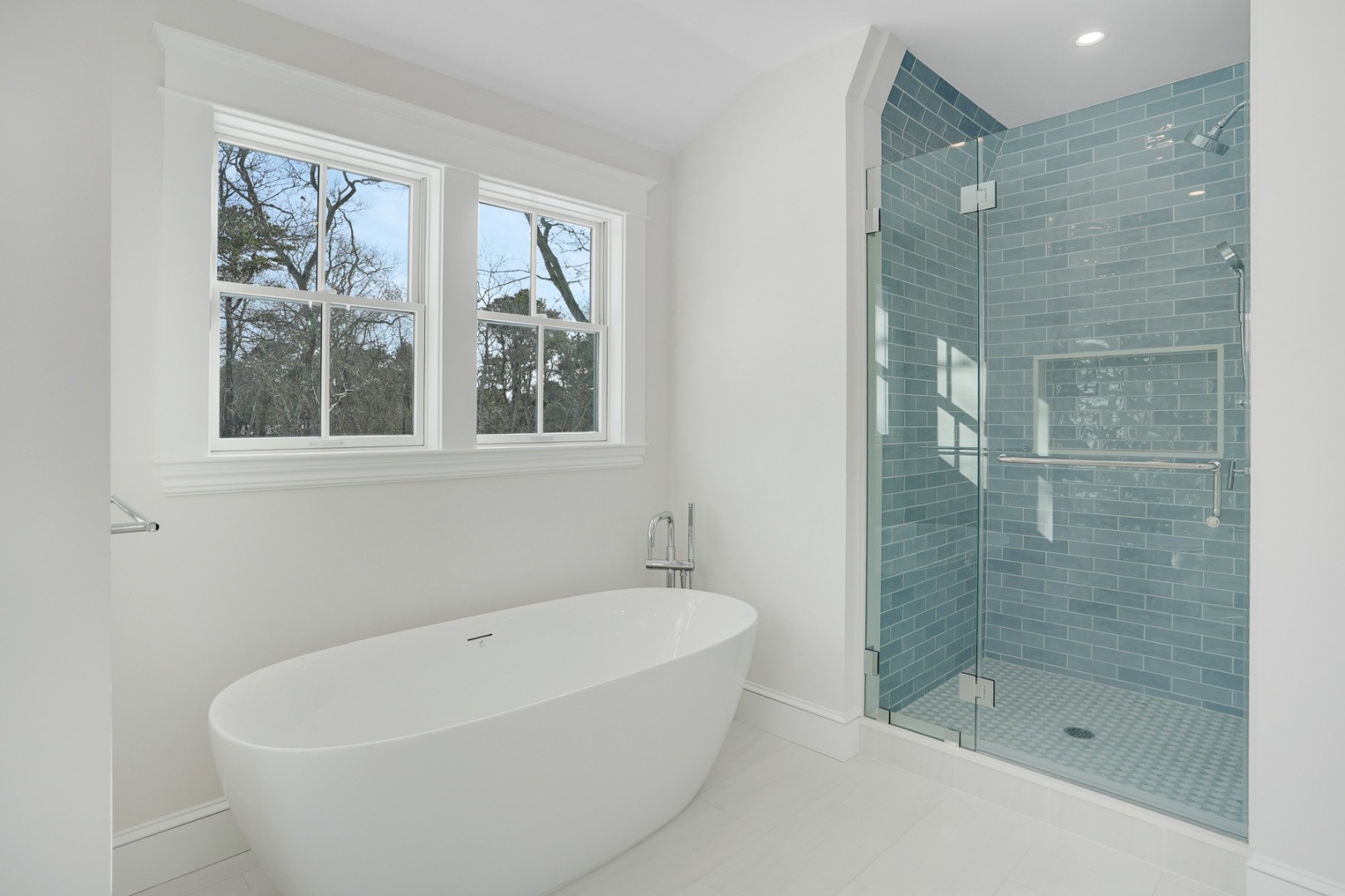 9 Martha's Way Edgartown, MA 02539 - Photo 27 of 41 a white bath tub sitting next to a shower