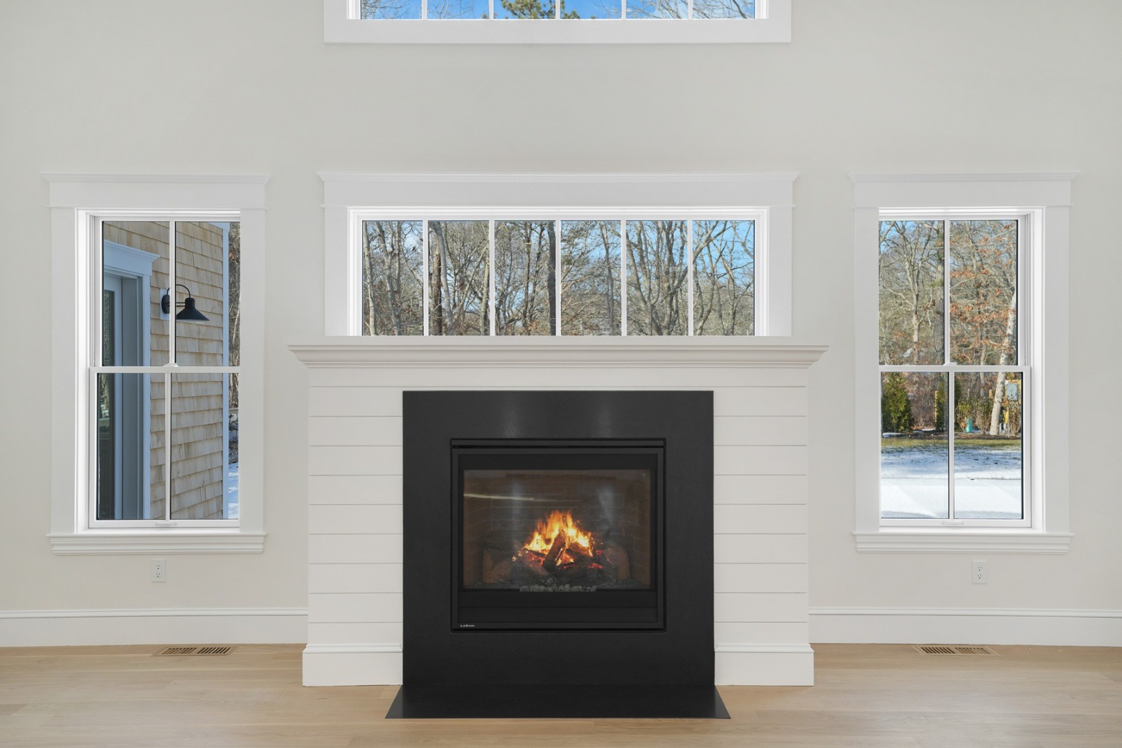 9 Martha's Way Edgartown, MA 02539 - Photo 3 of 41 a living room with a fireplace and a window