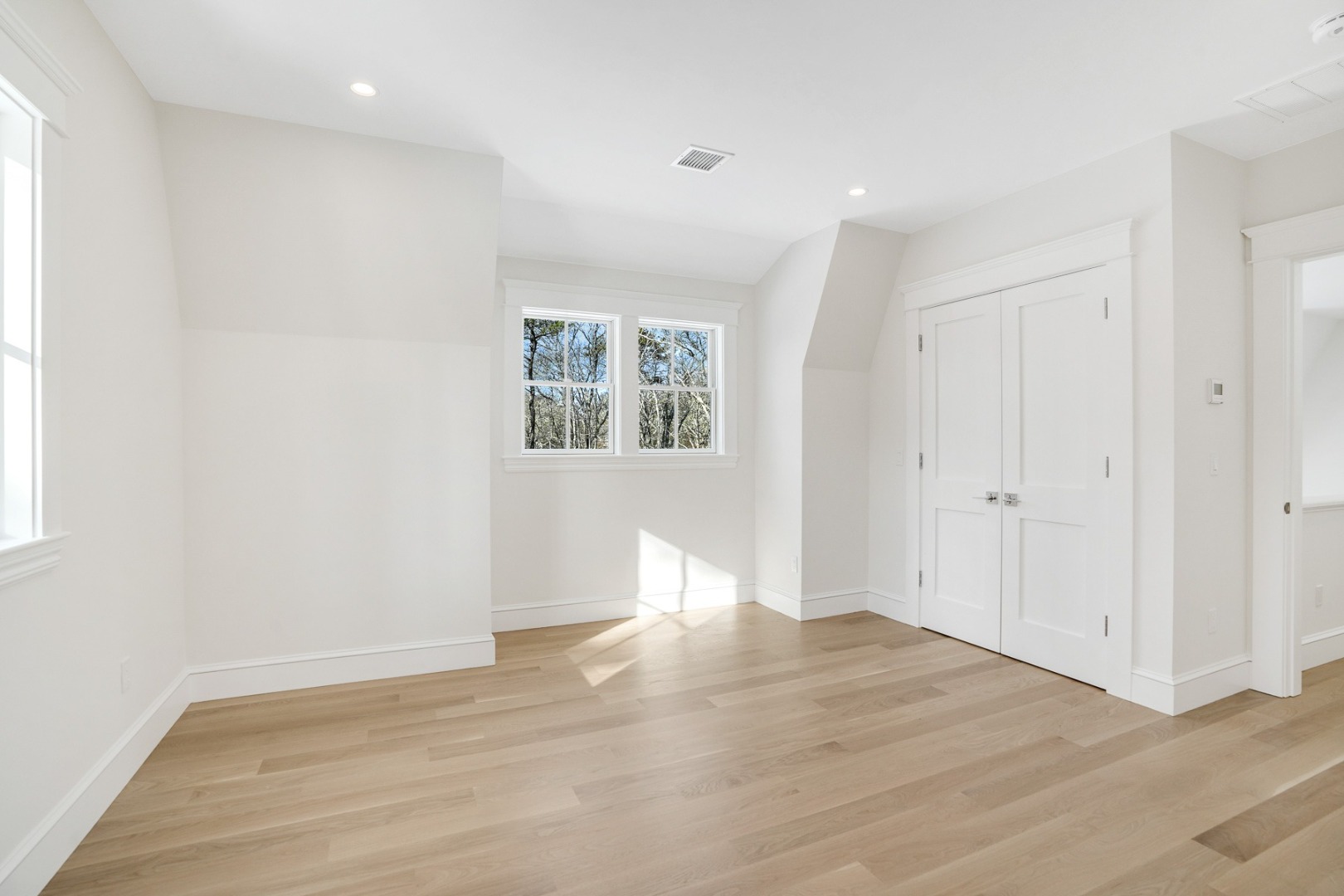 9 Martha's Way Edgartown, MA 02539 - Photo 36 of 41 an empty room with wooden floor and windows