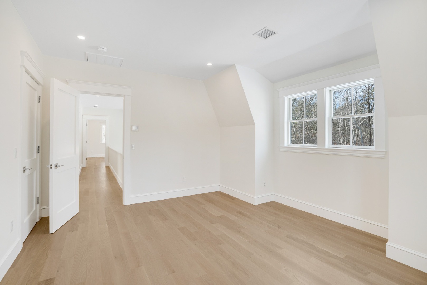 9 Martha's Way Edgartown, MA 02539 - Photo 39 of 41 an empty room with wooden floor and windows