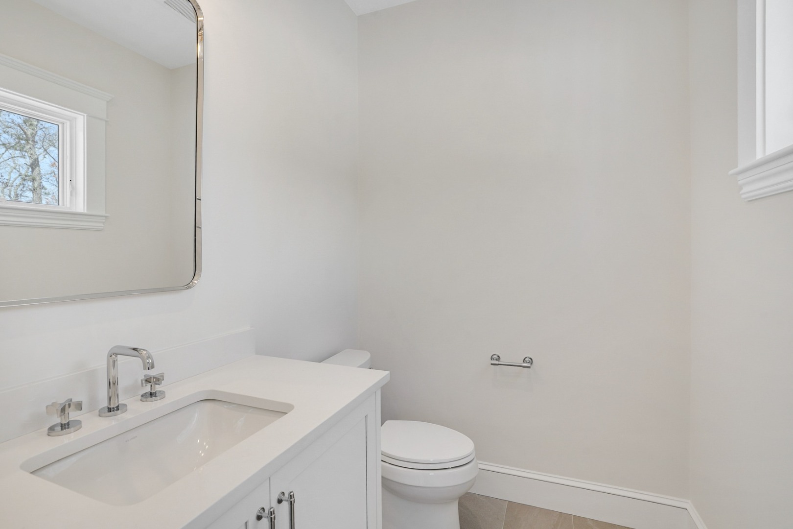9 Martha's Way Edgartown, MA 02539 - Photo 41 of 41 a bathroom with a toilet sink vanity and mirror