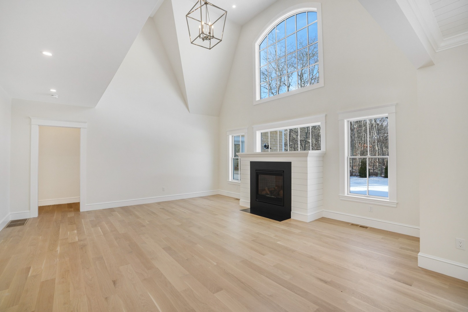 9 Martha's Way Edgartown, MA 02539 - Photo 6 of 41 an empty room with windows and fireplace