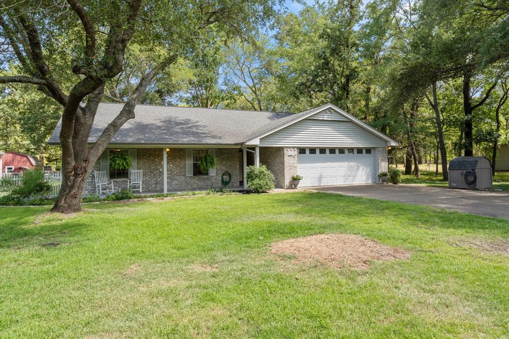 116 Meadowood Road Enchanted Oaks, TX 75156 - Photo 2 of 37 Ranch-style residence featuring a brick facade, covered front porch, and an attached two-car garage with a white panel door