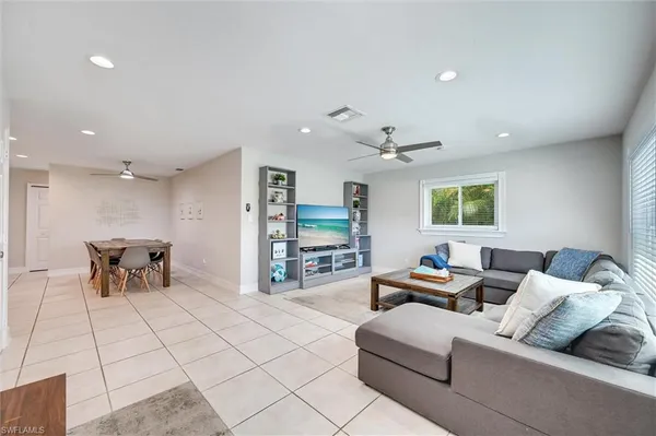 a living room with furniture and a table