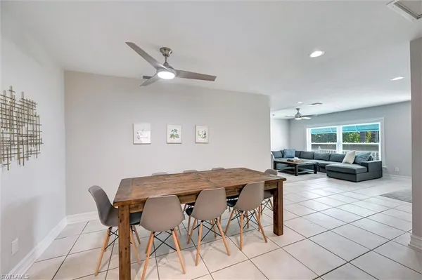 a view of a livingroom and a dining table and chairs