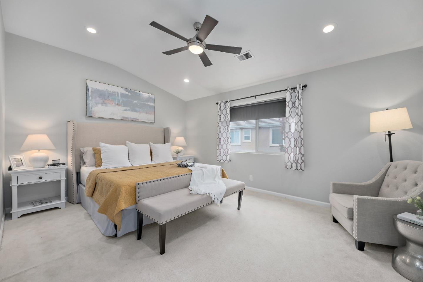 8931 Del Rio Circle Gilroy, CA 95020 - Photo 12 of 18 a spacious bedroom with a bed and a couch