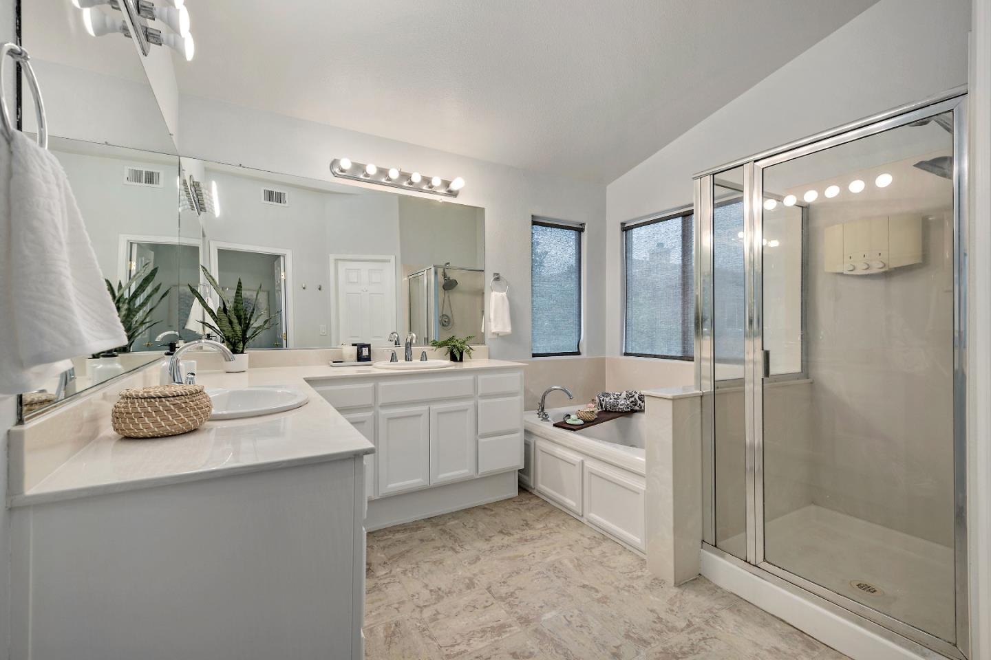 8931 Del Rio Circle Gilroy, CA 95020 - Photo 14 of 18 a bathroom with a double vanity sink and mirror