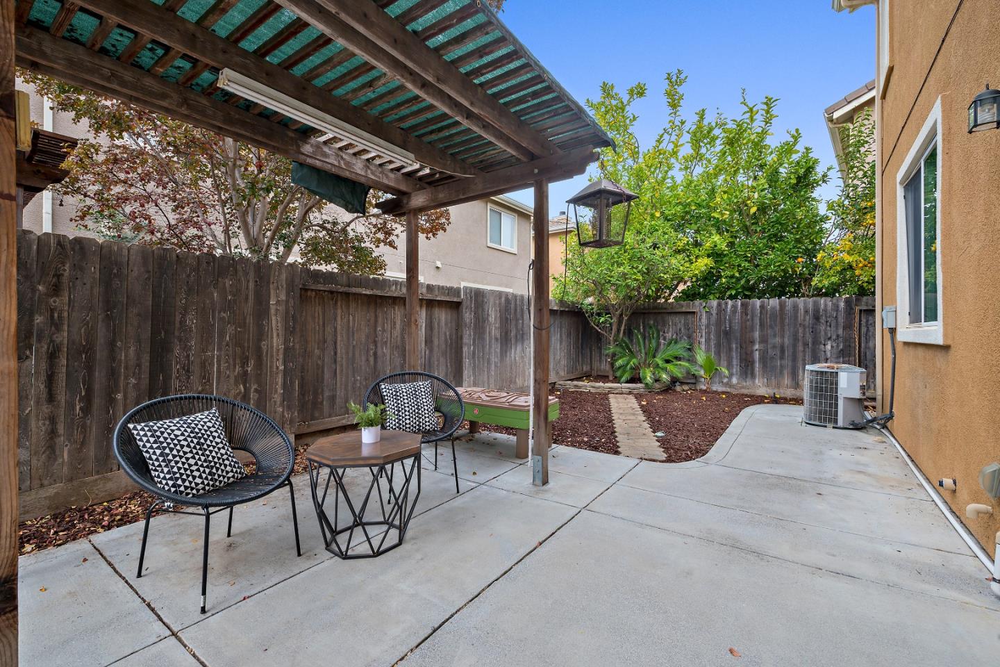 8931 Del Rio Circle Gilroy, CA 95020 - Photo 16 of 18 a view of outdoor sitting area with furniture and wooden fence