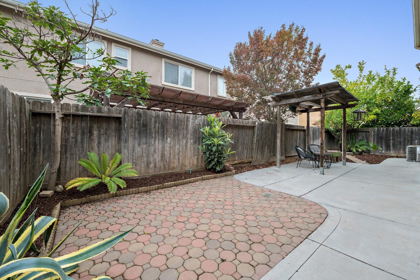 8931 Del Rio Circle Gilroy, CA 95020 - Photo 17 of 18 a view of a chair and table in backyard of house