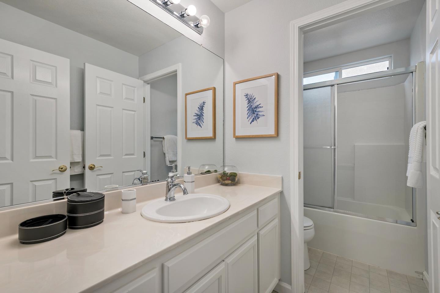 8931 Del Rio Circle Gilroy, CA 95020 - Photo 10 of 18 a bathroom with a sink double vanity and a mirror