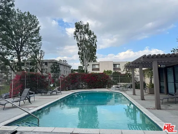 a view of a swimming pool with a patio