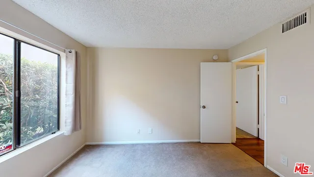 a view of an empty room with window