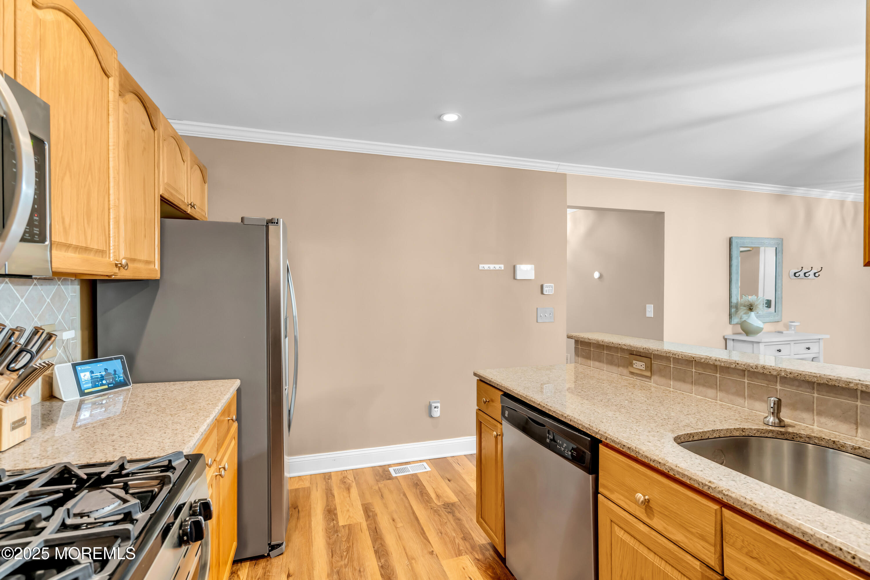 455 Deuce Drive Wall, NJ 07719 - Photo 13 of 26 a kitchen with a sink stove and cabinets