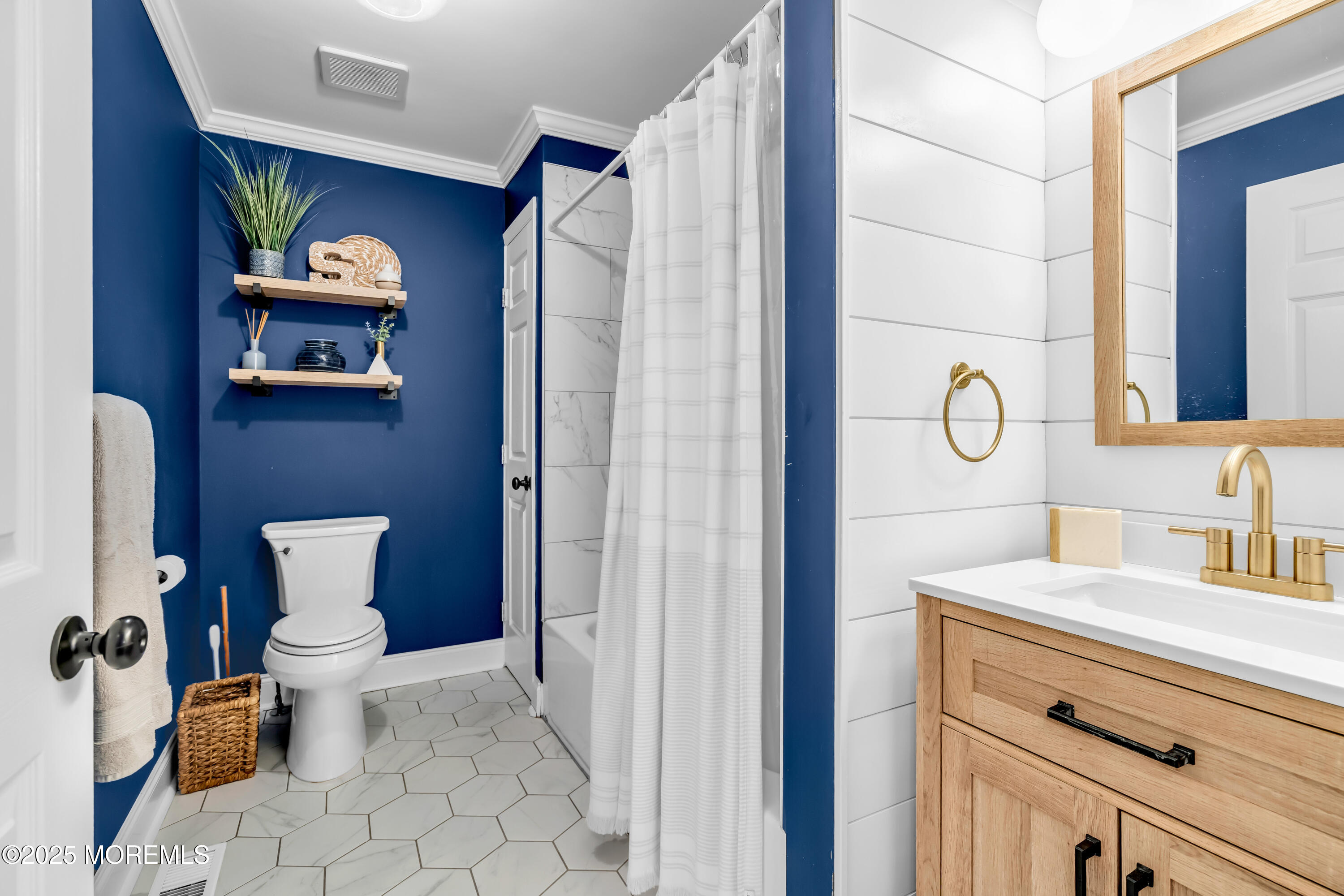 455 Deuce Drive Wall, NJ 07719 - Photo 17 of 26 a bathroom with a toilet sink and mirror