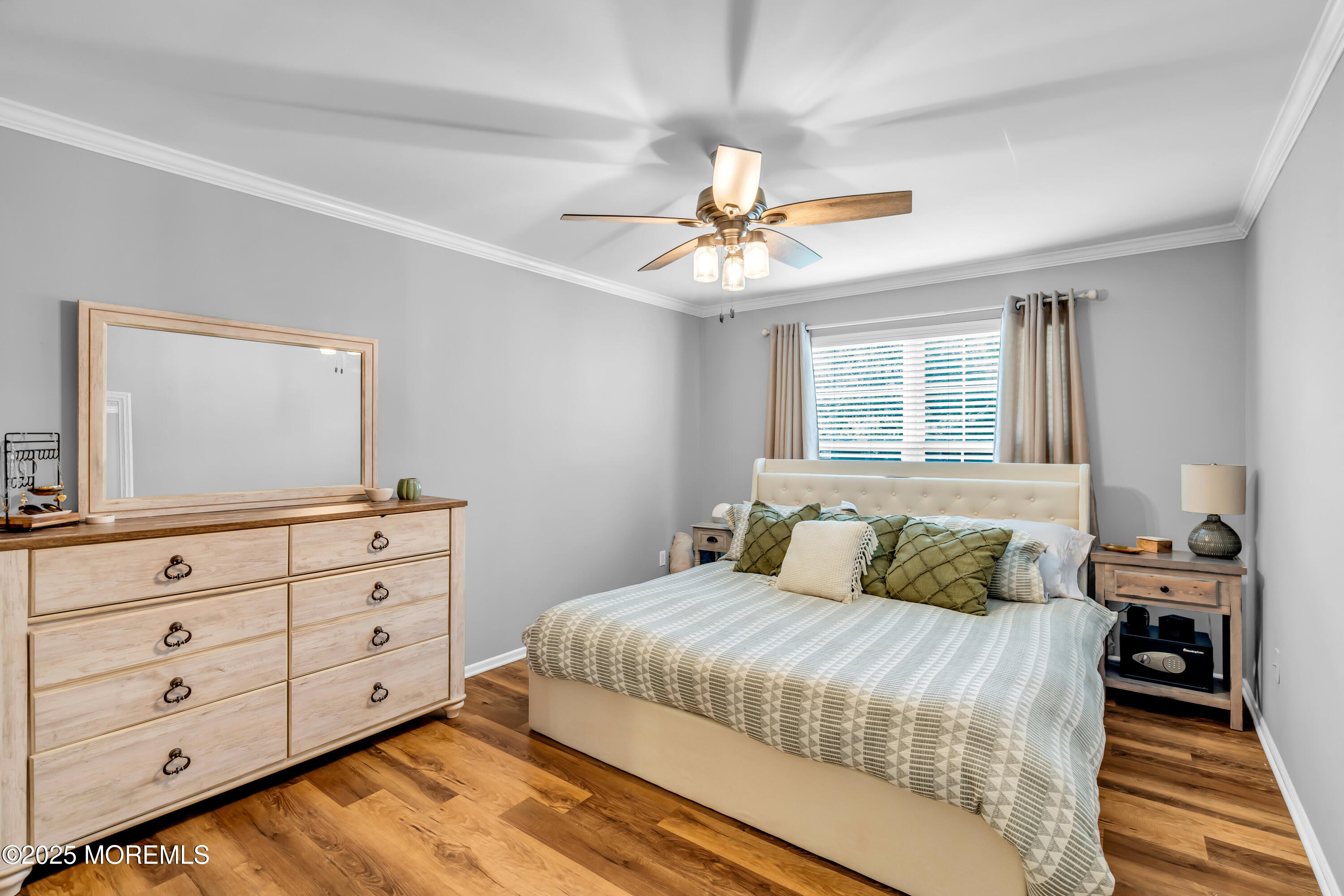 455 Deuce Drive Wall, NJ 07719 - Photo 18 of 26 a bedroom with a large bed and a dresser