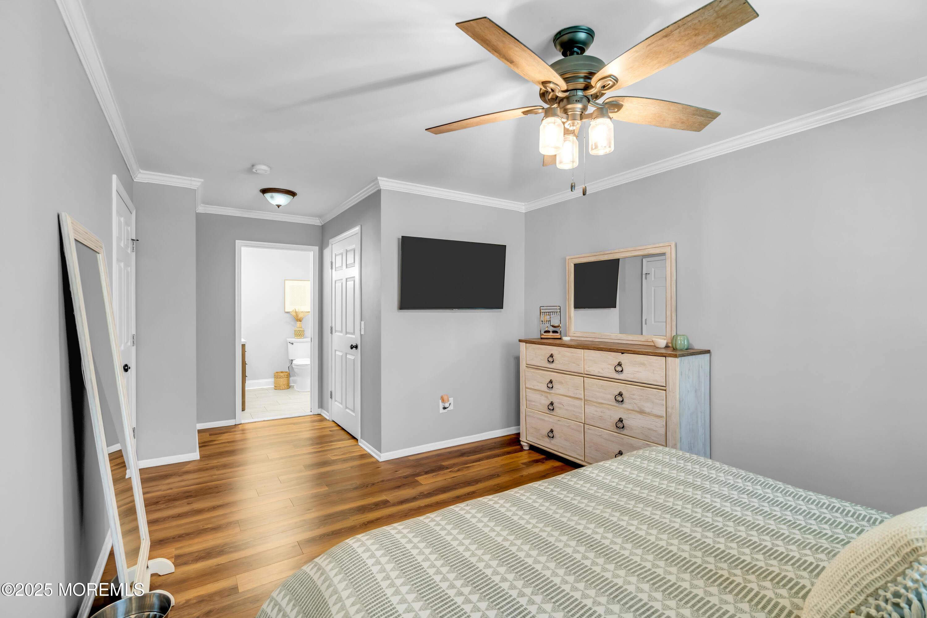 455 Deuce Drive Wall, NJ 07719 - Photo 19 of 26 a bedroom with a bed and a flat screen tv