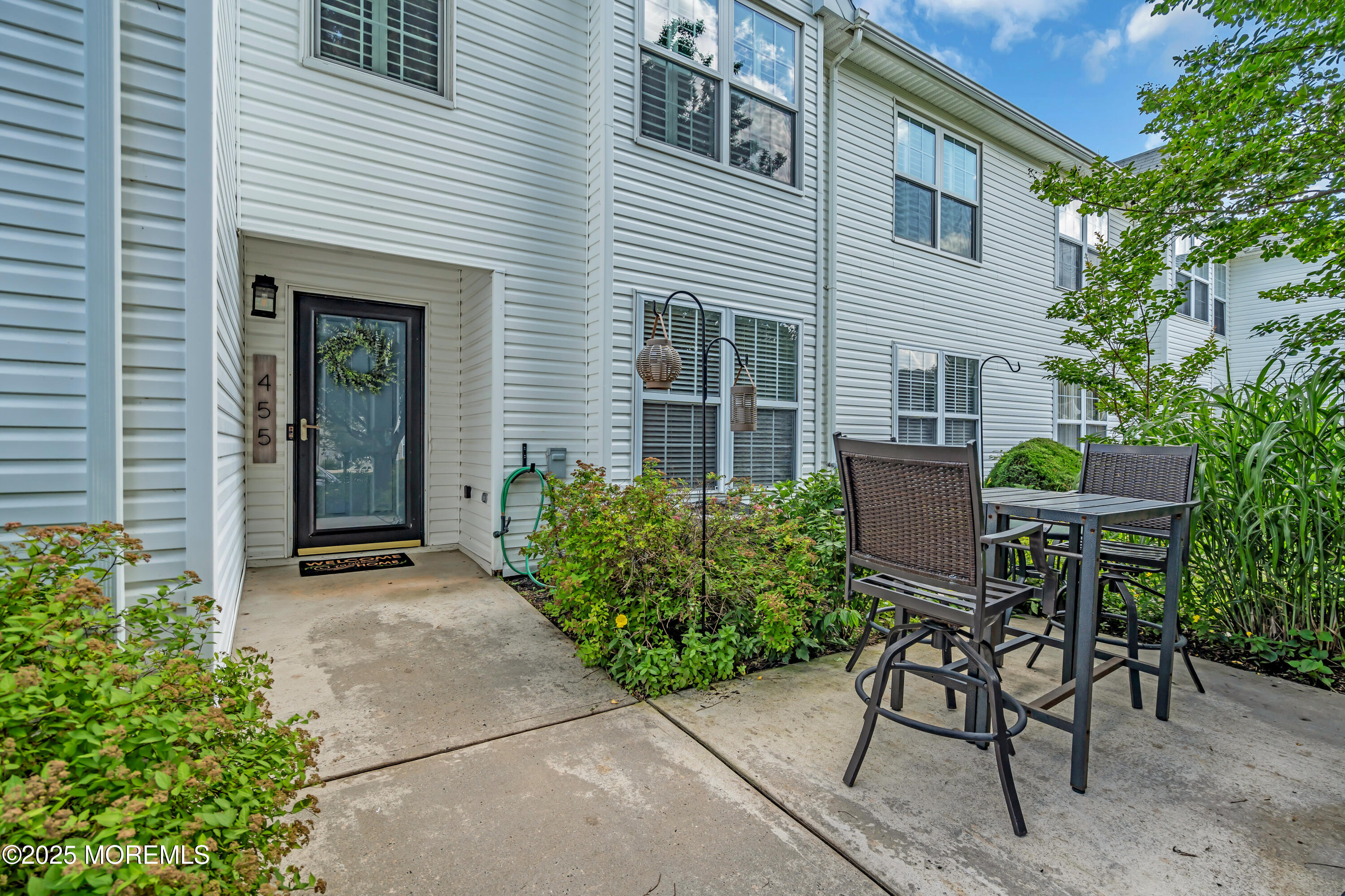 455 Deuce Drive Wall, NJ 07719 - Photo 2 of 26 a view of a chair and table in back of the house
