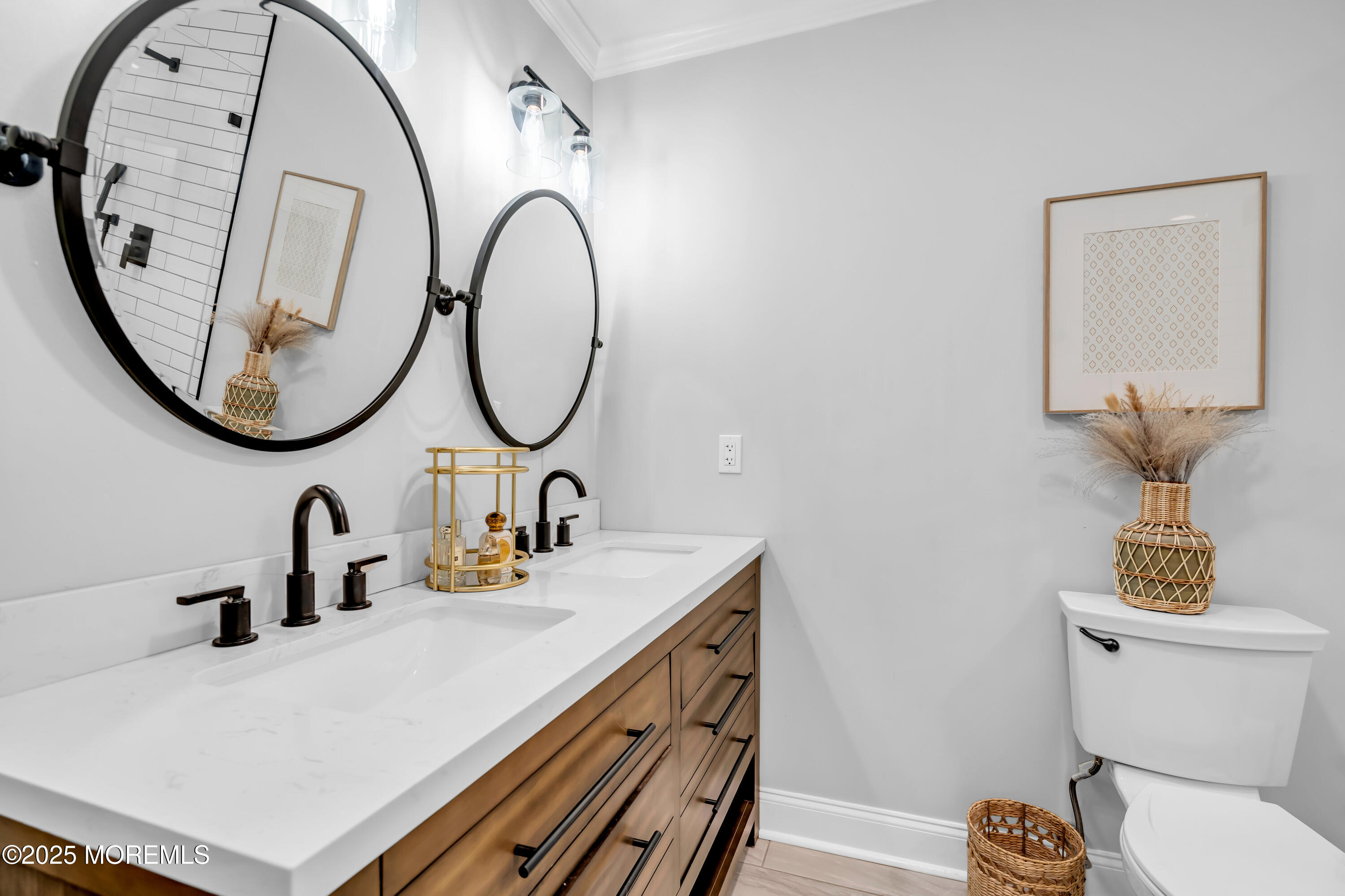455 Deuce Drive Wall, NJ 07719 - Photo 21 of 26 a bathroom with a sink and a mirror