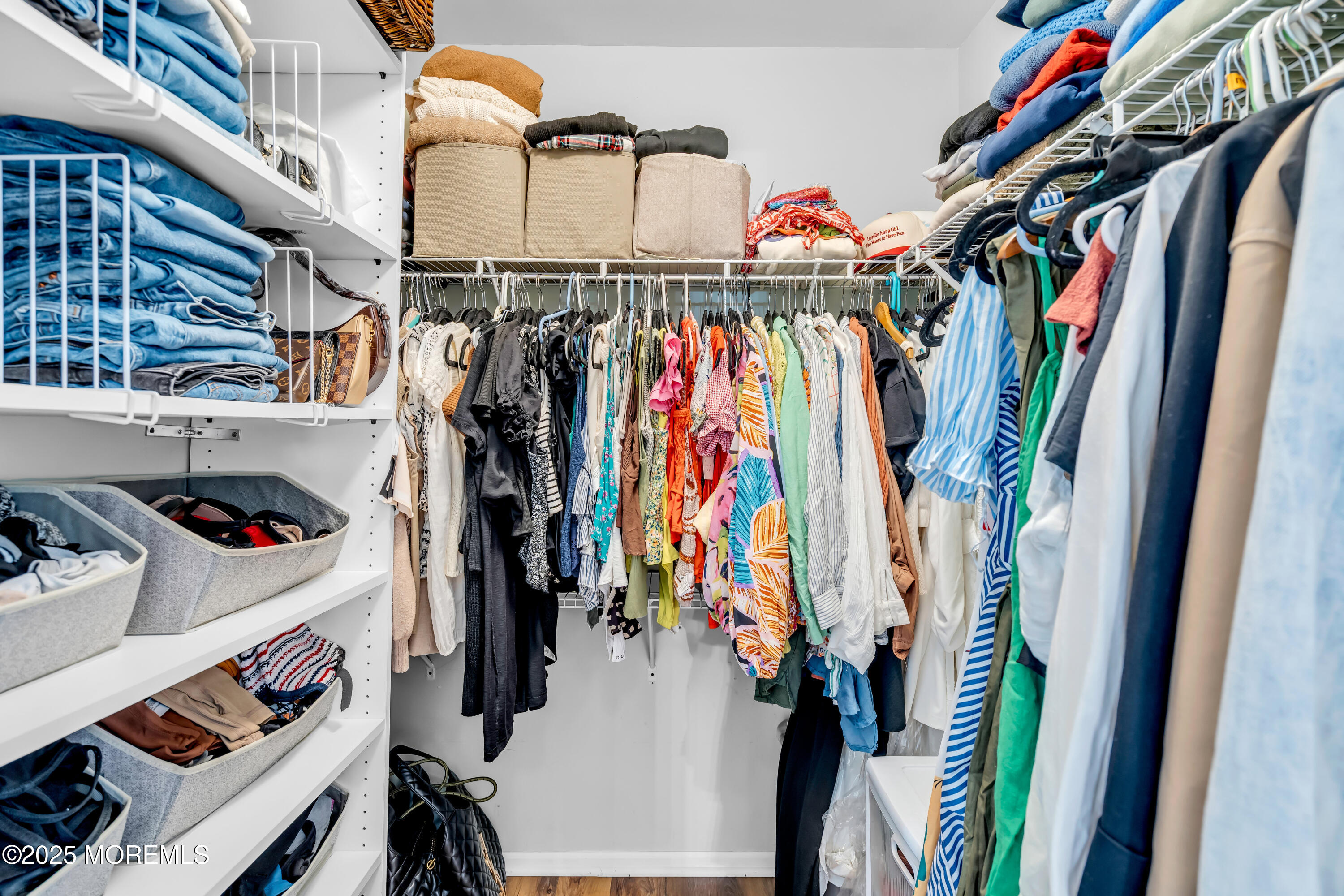455 Deuce Drive Wall, NJ 07719 - Photo 23 of 26 a view of walk in closet with clothes and shoes