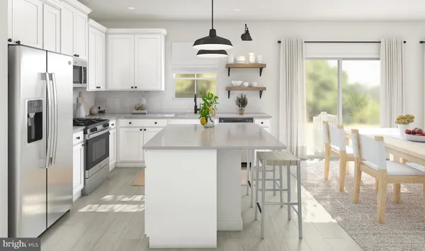 a kitchen with stainless steel appliances granite countertop a stove a refrigerator a oven and white cabinets with wooden floor