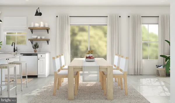 a dining room with furniture and a window