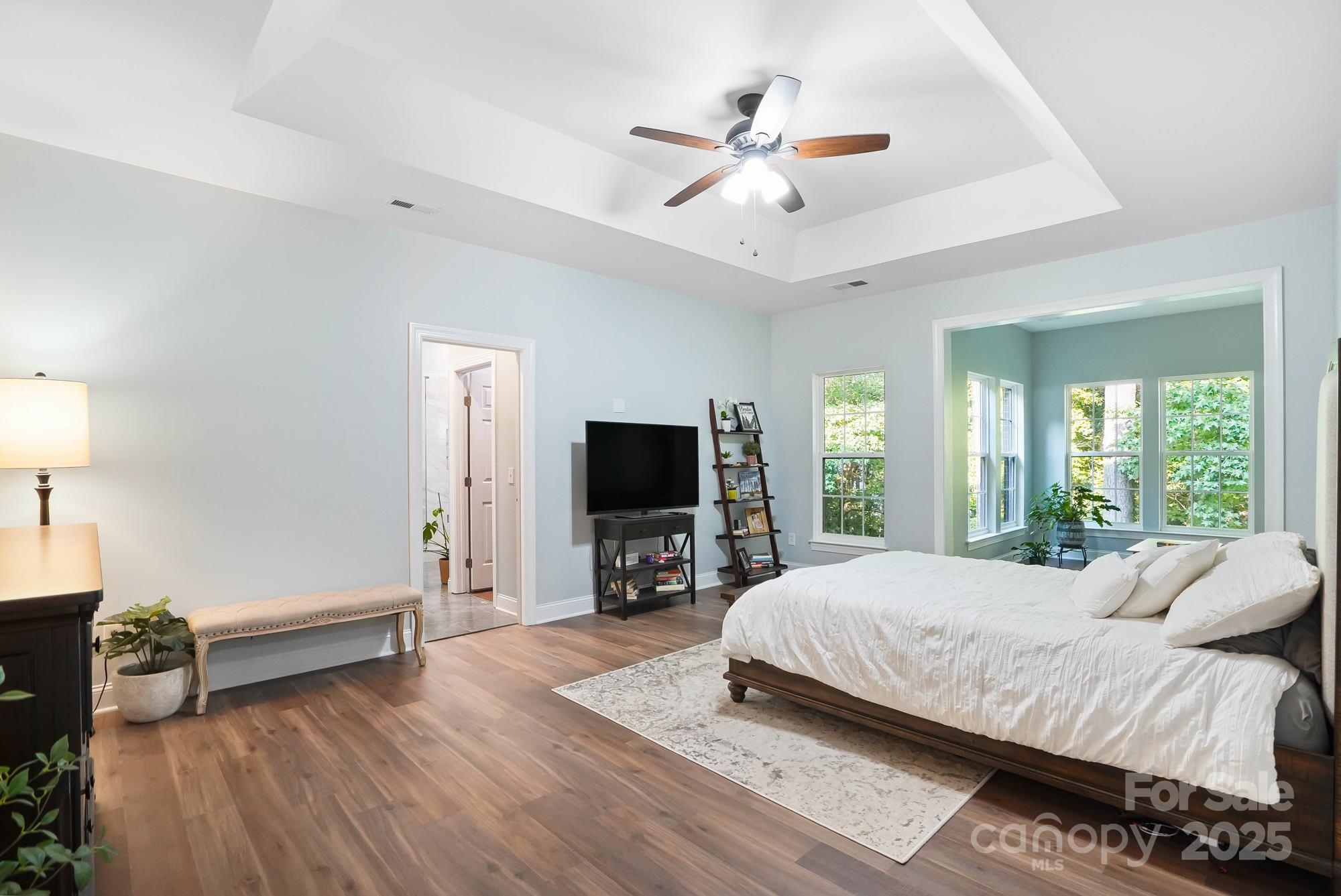 409 Stonewater Bay Mount Holly, NC 28120 - Photo 30 of 47 a bedroom with a bed and a flat screen tv