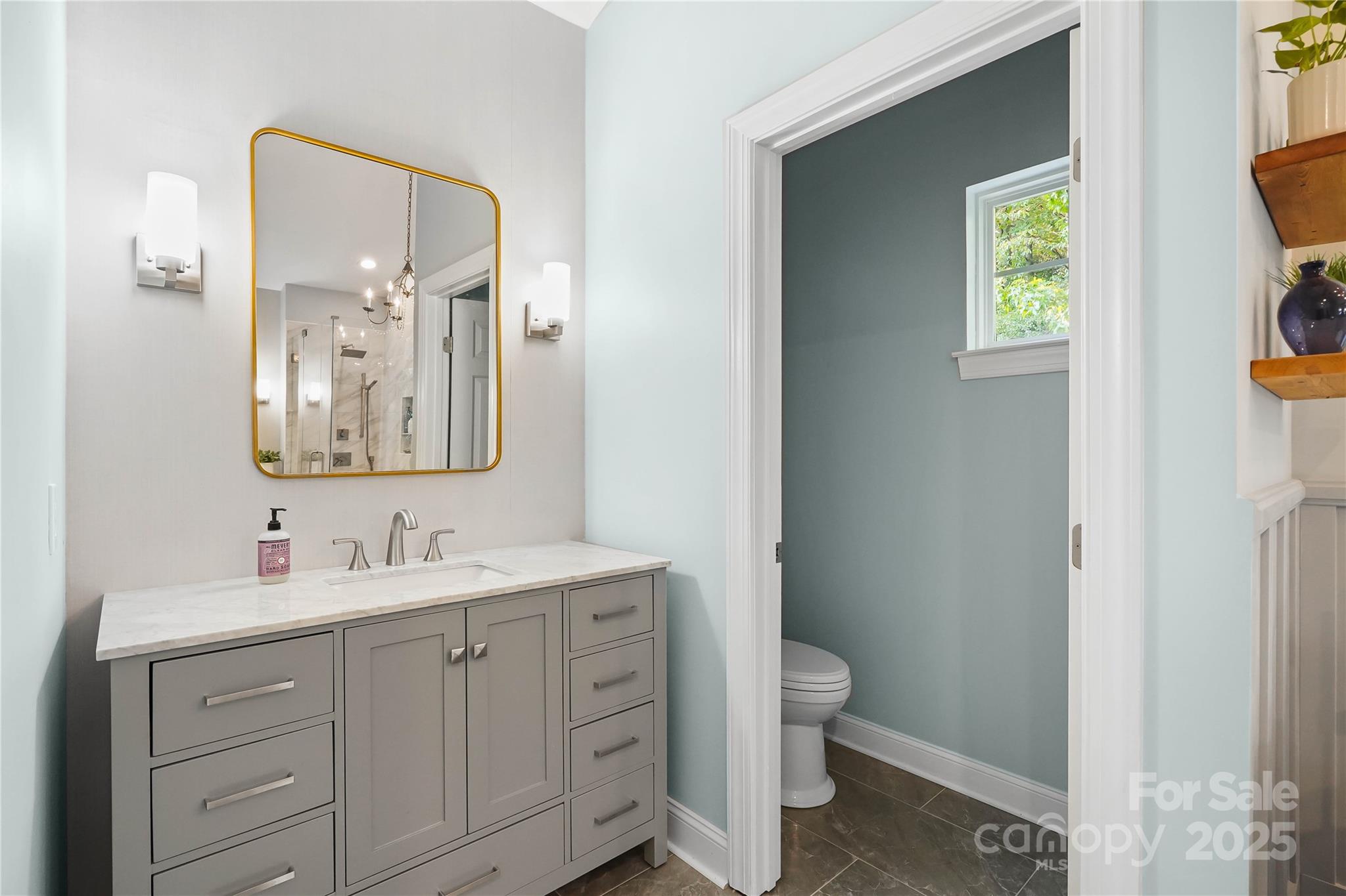 409 Stonewater Bay Mount Holly, NC 28120 - Photo 33 of 47 a bathroom with a toilet sink and mirror