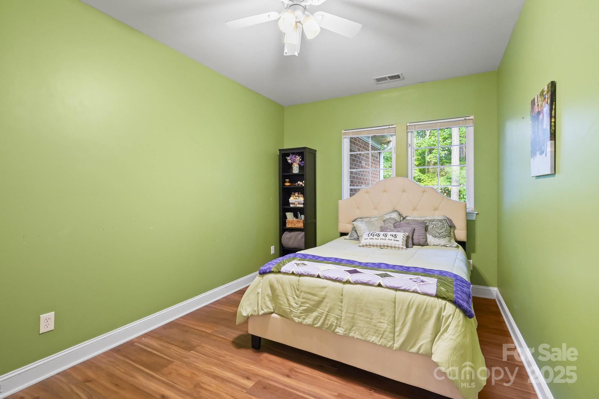 409 Stonewater Bay Mount Holly, NC 28120 - Photo 39 of 47 a bedroom with a bed and a window