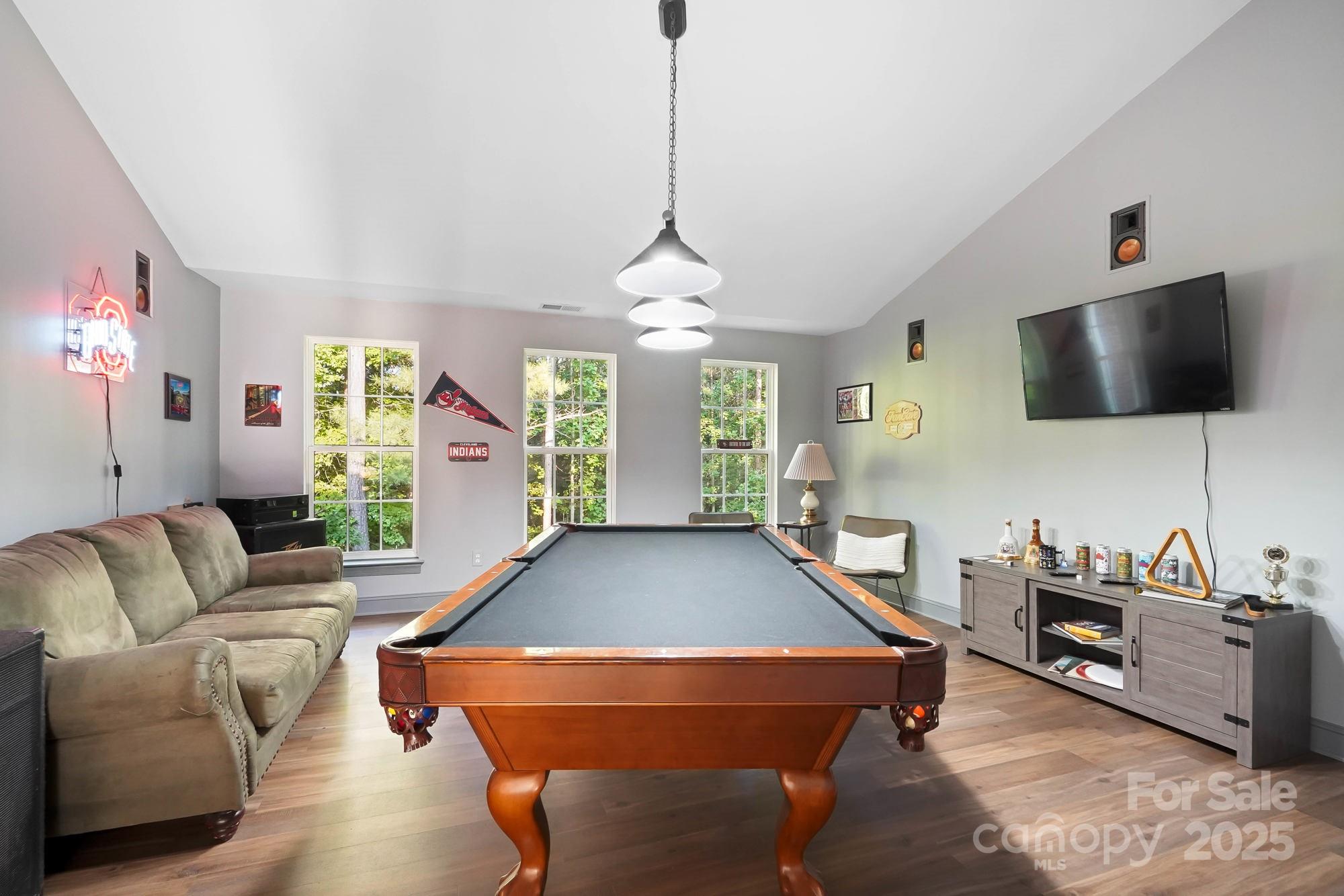 409 Stonewater Bay Mount Holly, NC 28120 - Photo 41 of 47 a living room with furniture and a flat screen tv