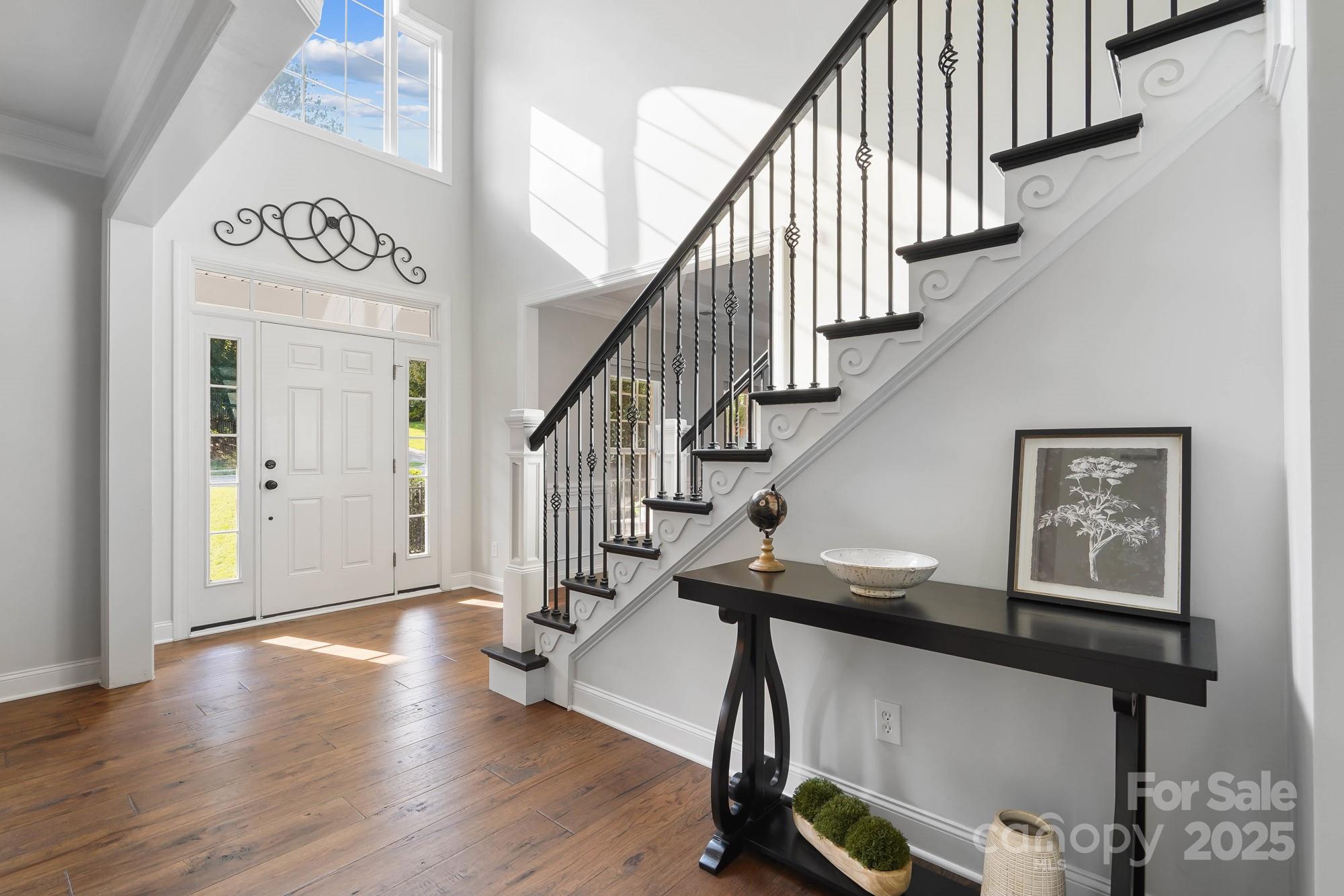 409 Stonewater Bay Mount Holly, NC 28120 - Photo 7 of 47 a view of entryway and hall with wooden floor