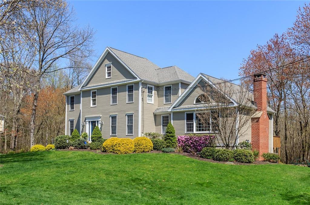 99 Meadow Road West Trumbull, CT 06611 - Photo 1 of 1 a front view of a house with a garden