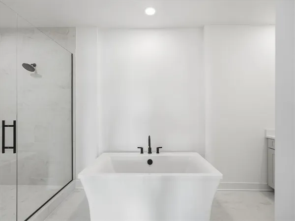 a white bath tub sitting in a bathroom