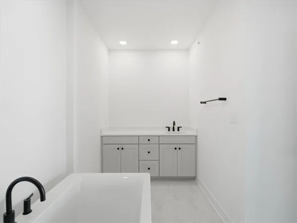 a spacious bathroom with a sink