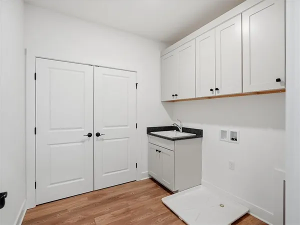 a view of cabinets and wooden floor