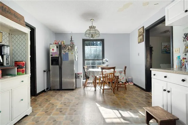a kitchen with appliances cabinets and a window