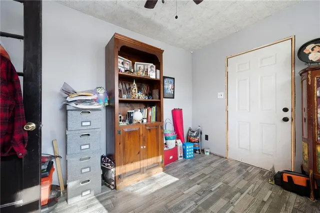 a living room filled with furniture and a window