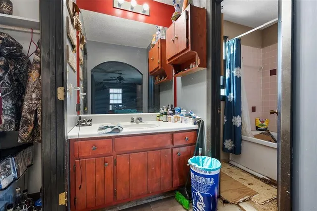 a work room with wooden floor and furniture